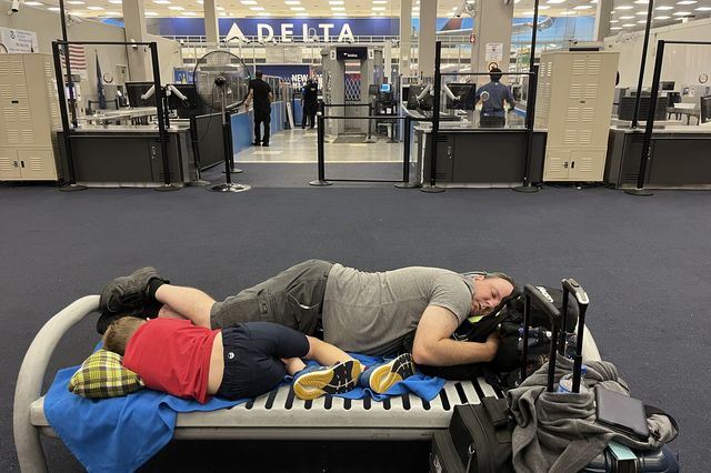 A father and son slept at JFK Airport after their flight was cancelled.